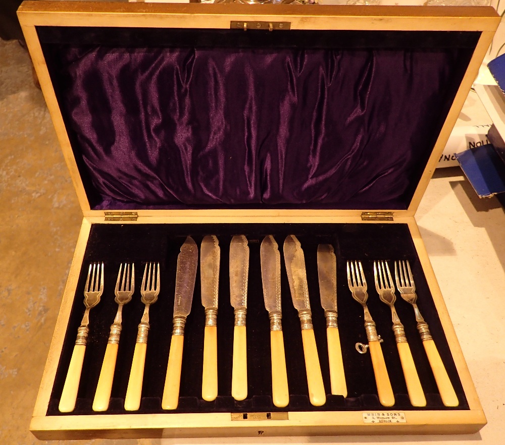 Mahogany cased canteen of fish knives and forks