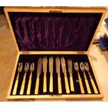 Mahogany cased canteen of fish knives and forks