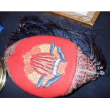 Unusual Eastern type red velvet hat embroidered 20 X1 1943 with rear tassels