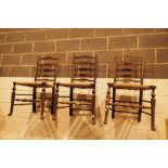 Three ladderback chairs with woven seats