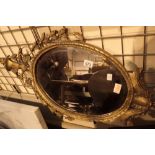 Large oval ornate gilt framed mirror