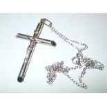 Presumed silver crucifix on silver chain,