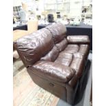 Two seater brown leather double recliner settee