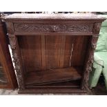Heavy carved oak bookcase W: 104 cm