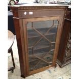 Corner glass fronted cabinet on base in mahogany H: 115 cm