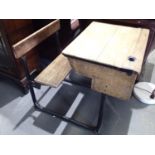 Childs early 20thC desk with folding seat on a steel frame