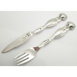 1927 Georg Jensen fish knife and fork with cast dolphin handles and shell finial Christian F Heise