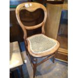 Vintage spoonback cane seat chair