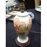Moorcroft cream ground table lamp in the Hibiscus pattern