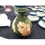 Moorcroft bulbous vase in the Coral Hibiscus pattern H: 20 cm