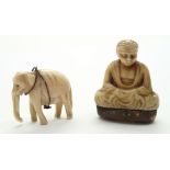 Two small bone figurines, an elephant and a Prayer charm