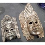 Two Asian wooden face masks, largest H: 35 cm