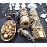 Collection of African carved items including masks, drums, carved water buffalo etc