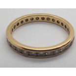 An 18ct gold eternity ring containing a total of 1ct diamonds. 2g, size N