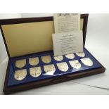 Cased The Royal Arms set of twelve hallmarked silver ingots 725 grains each issued by Danbury Mint