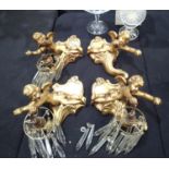 Four plaster cherubs, three with crystal drop light fittings. Cherubs are L: 30 cm Condition Report: