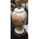 Moorcroft cream ground table lamp in the Hibiscus pattern H: 35 cm