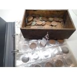 Collection of GB coins in album and an old tin of copper coinage