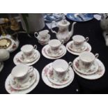 Royal Albert twenty one piece coffee set in the Moss Rose pattern.First and seconds quality. No