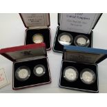 Boxed silver proof 1997 £2 coin, 1990 5p two coin set, 1992 10p two coin set and a 1997 50p two coin