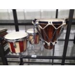 Pair of modern wood and stainless steel bongo drums and an Ethnic type drum