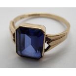 A 9ct solitaire ring set with a large sapphire. 2.8g, size P Condition Report: The size of the stone