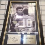 Framed photograph of Mohammad Ali and Pele with COA from Jonathan Grant collectables. Frame 65cm x