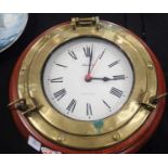 Brass and mahogany mounted Marine porthole type quartz movement clock. Not working at preset. Item