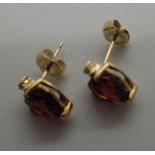 Pair of 9ct gold garnet and diamond earrings, never worn, 1.5g