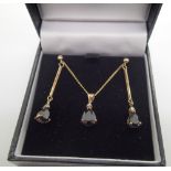 Matching sapphire and diamond earring and pendant set