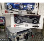 Three boxed Burago diecast cars, Bugatti Jaguar and Mercedes Benz