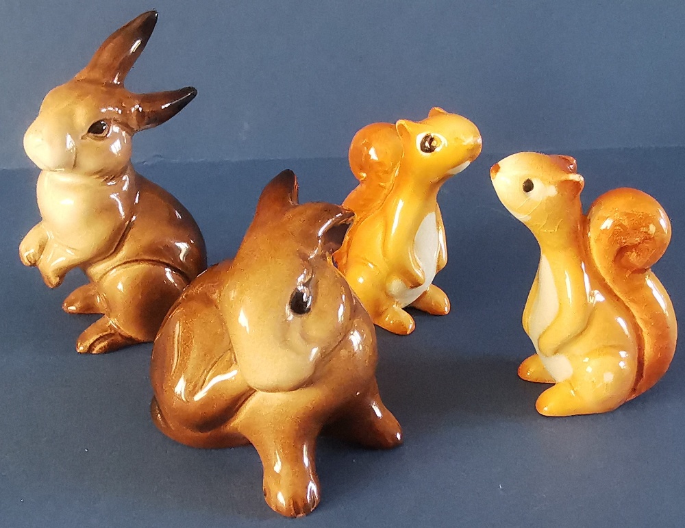 Four Beswick items to include: Two Squirrels - Standing - No. 1007 in gloss - 2.25". Rabbit