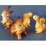 Four Beswick items to include: Two Squirrels - Standing - No. 1007 in gloss - 2.25". Rabbit