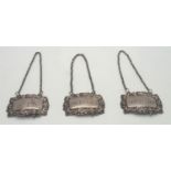 Set of three hallmarked silver wine labels, whiskey, brandy and gin assay Birmingham 1860, maker A &