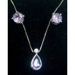 18ct gold amethyst set earrings and pendant set 4.3g. P&P group 1 (£16 for the first item and £1.