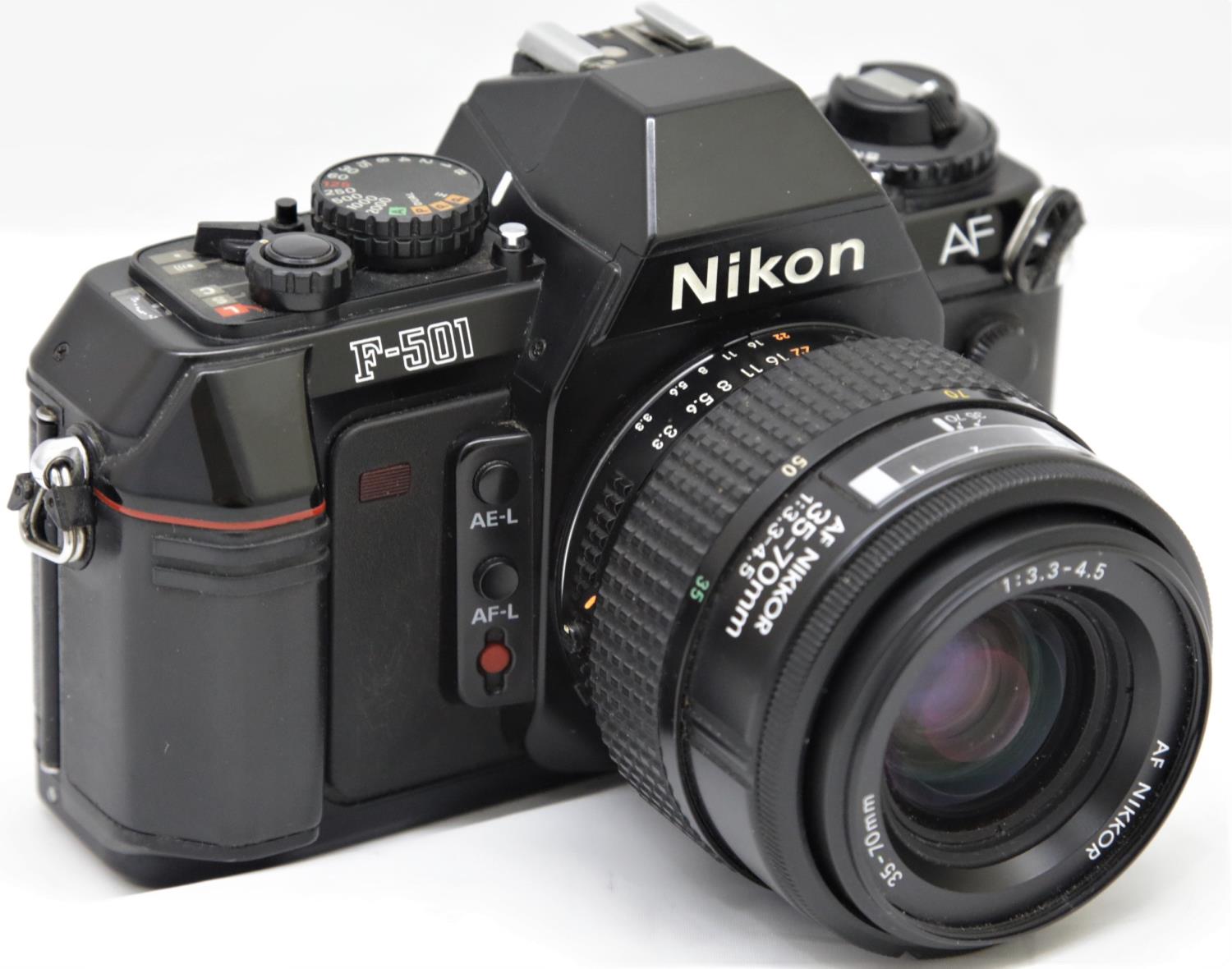 Nikon F-501 35mm film camera with AF Nikkor 35 - 70 zoom lens. P&P