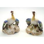 Pair of ceramic birds of paradise, each having gold anchor mark to the base. H: 9 cm. P&P group