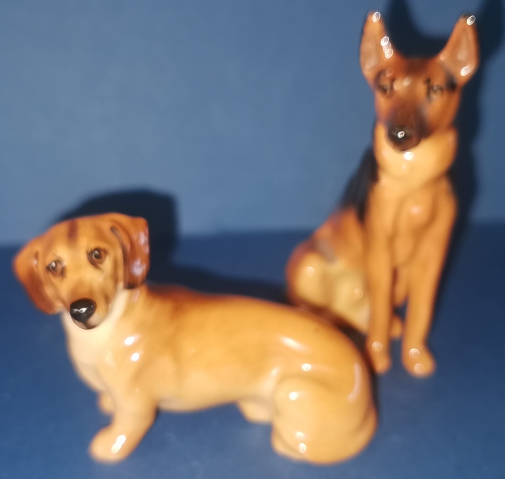 Two Royal Doulton Dogs to include: Alsatian - No. K13 in gloss - 3" Dachshund - No. K17 in gloss -