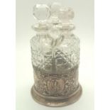 Hallmarked silver three bottle cruet with lue player panel, one replacement stopper, Chester