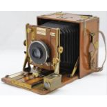 Sanderson Quarter Plate Tropical Hand & Stand Camera from around 1910 in Teak. It has an Wollensak