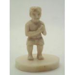 Small carved bone figure of an Indian man clapping H: 40 mm. P&P group 1 (£16 for the first item and