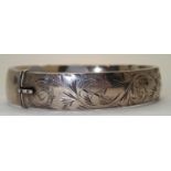 Sterling silver hinged 12mm engraved bangle. P&P group 1 (£16 for the first item and £1.50 for