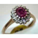 Ladies 9ct gold, ruby and diamond ring size N/O. P&P group 1 (£16 for the first item and £1.50 for