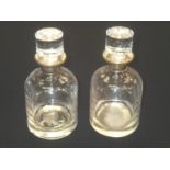Pair of Millenium silver hallmarked decanters by Broadway & Co H: 22 cm. P&P group 1 (£16 for the