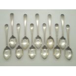 Eleven hallmarked silver teaspoons with inscribed letter G assay Sheffield 1913 maker WT 289g. P&P