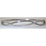 9ct white gold and diamond bangle D: 67 mm 12.0g. P&P group 1 (£16 for the first item and £1.50