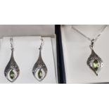 Matching sterling silver pendant earrings & pendant on chain, each with marquise cut peridots. P&P