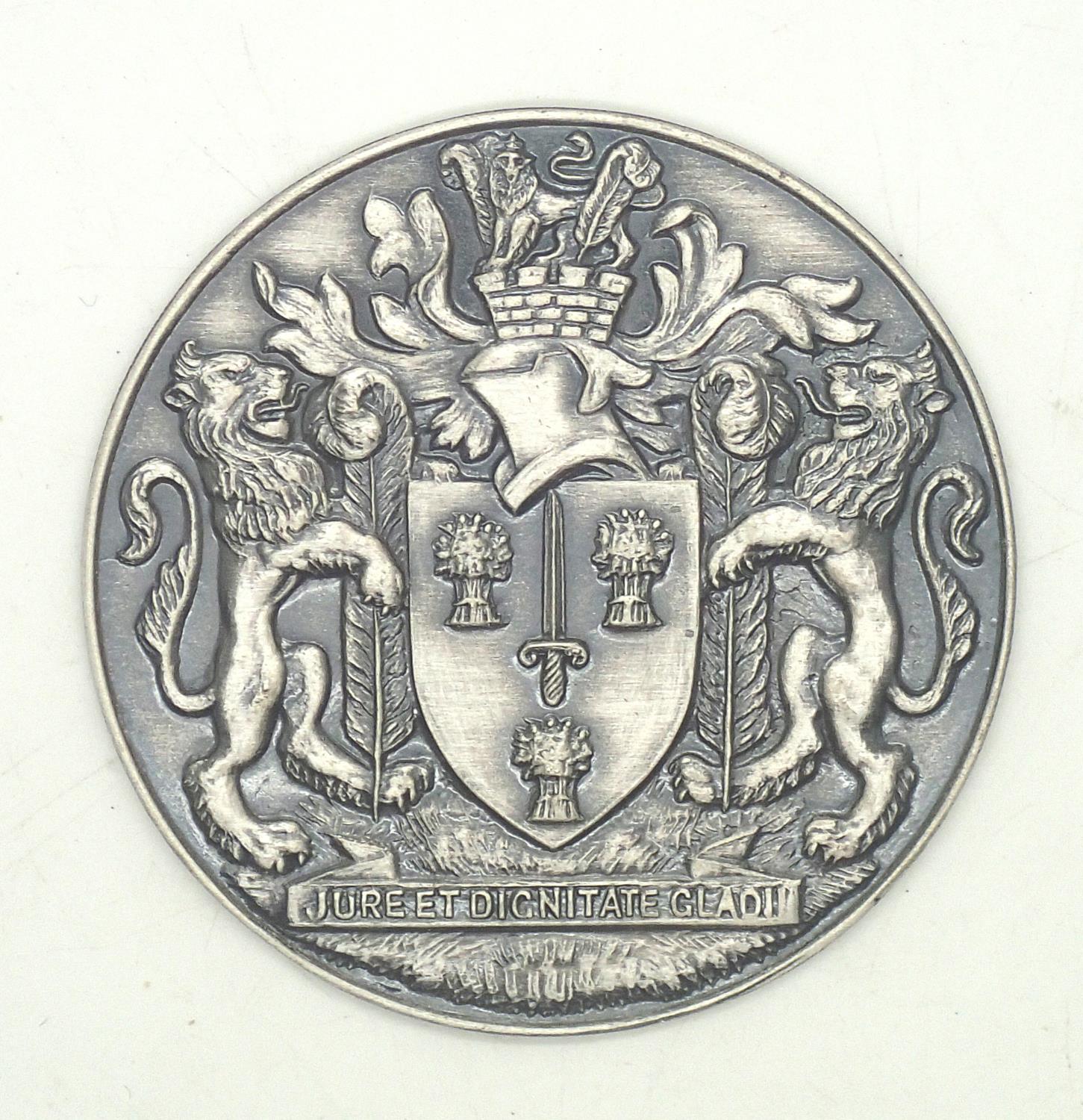 White metal presumed silver Cheshire county plaque "By The Right And Dignity Of The Sword" D: 52 mm.