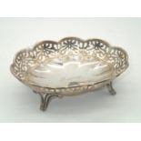 Hallmarked Silver bon bon dish with pierced decoration on four legs Assay London 1904 113g L: 15 cm,