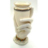 Royal Worcester glazed ceramic vase in the form of a hand grasping a conical receptacle, with